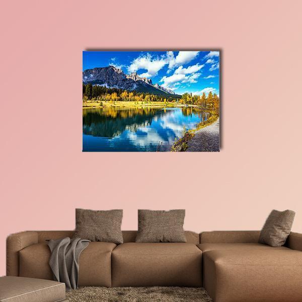 Yellowing Aspens Around Alpine Lake Canvas Wall Art in yellow, green and blue, single panel hung on a wall