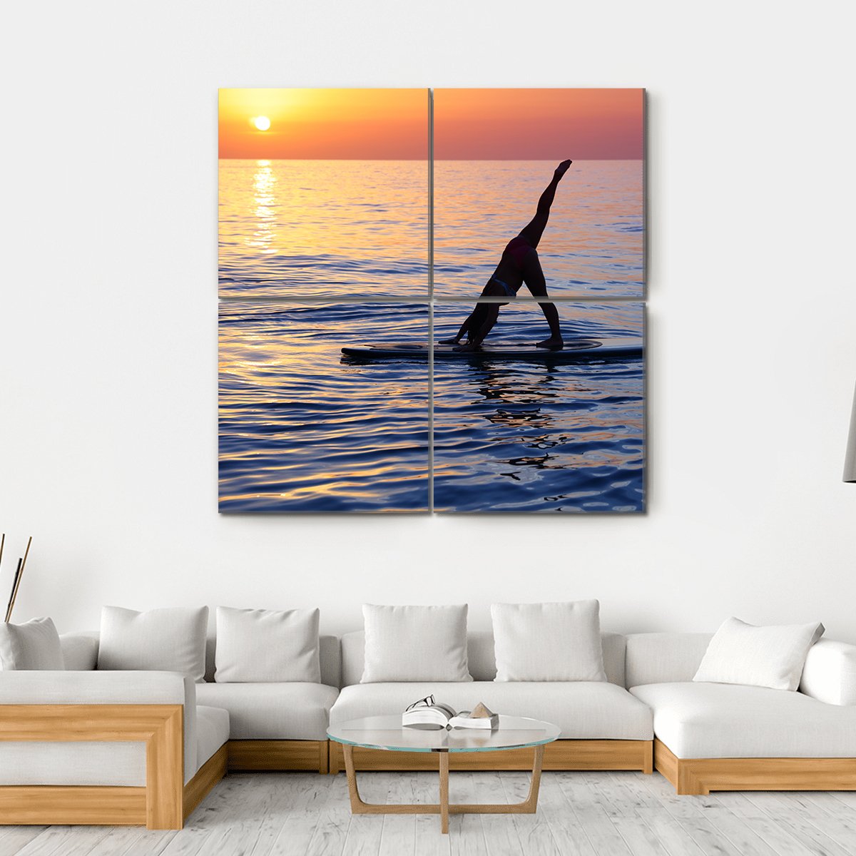 Paddleboard Yoga at Sunset Canvas Wall Art in orange, yellow and blue, single panel hung on a wall
