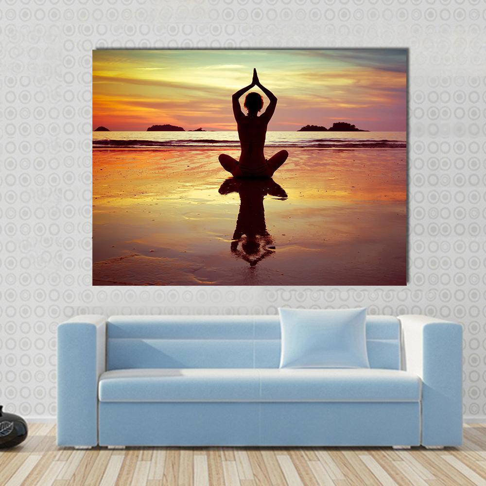 Yoga on the Beach Canvas Wall Art in brown, orange and yellow, single panel hung on a wall