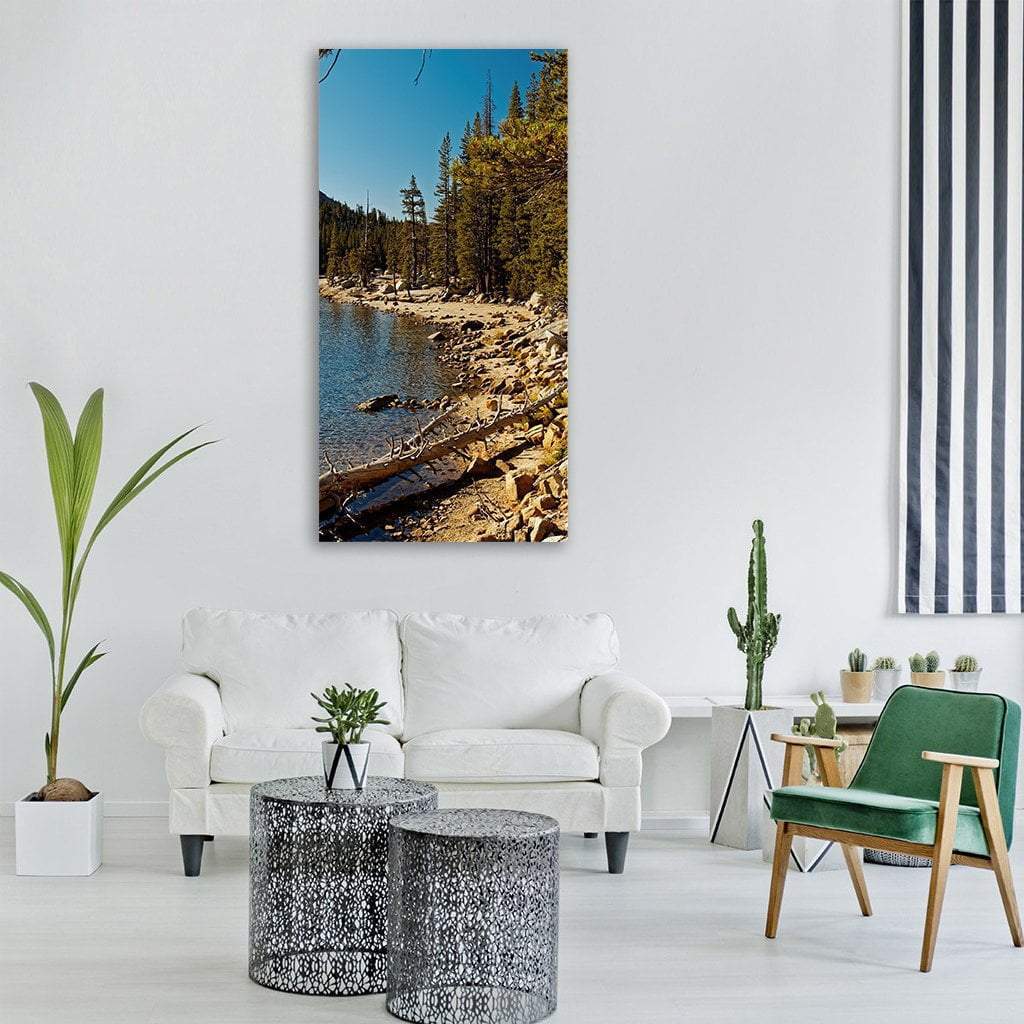 Yosemite Lake with Pine Trees Vertical Canvas Wall Art in brown, green and blue, single vertical panel hung on a wall