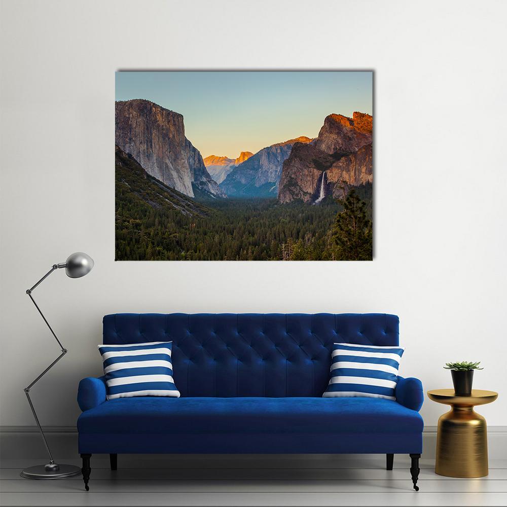 Yosemite Valley at Sunset Canvas Wall Art in orange, green and blue, single panel hung on a wall
