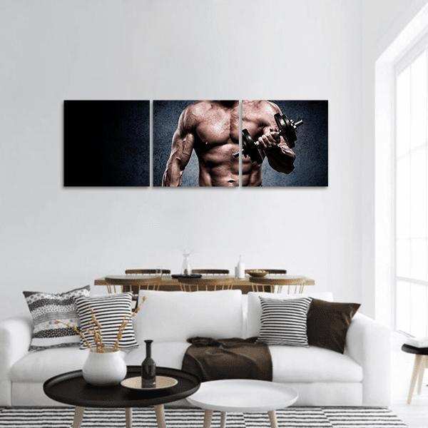 Young Man Training Biceps Panoramic Canvas Wall Art in black, brown and navy, hung on a wall