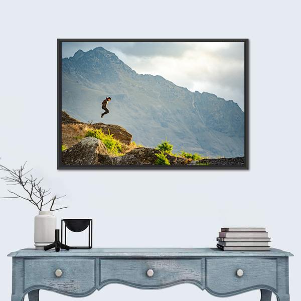 Young Man Jumping On Queenstown Hill Canvas Wall Art-1 Piece-Floating Frame-24&quot; x 16&quot;-Tiaracle