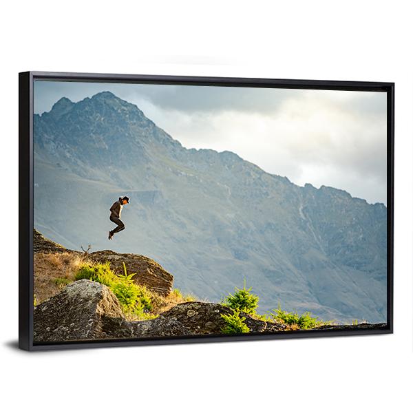 Young Man Jumping On Queenstown Hill Canvas Wall Art-3 Horizontal-Gallery Wrap-25&quot; x 16&quot;-Tiaracle