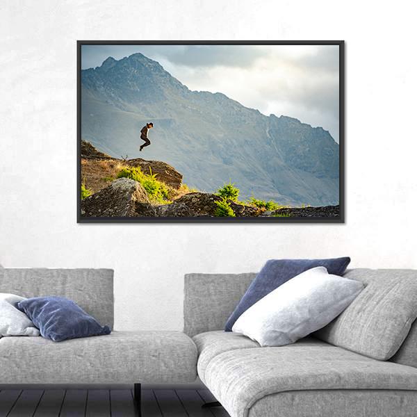 Young Man Jumping On Queenstown Hill Canvas Wall Art-3 Horizontal-Gallery Wrap-25&quot; x 16&quot;-Tiaracle