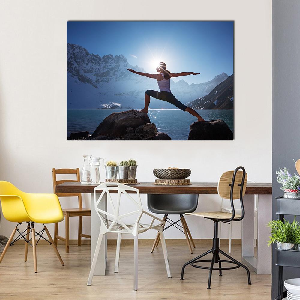 Woman in Warrior Ii at Mountain Lake Canvas Wall Art in black, white and blue, single panel hung on a wall