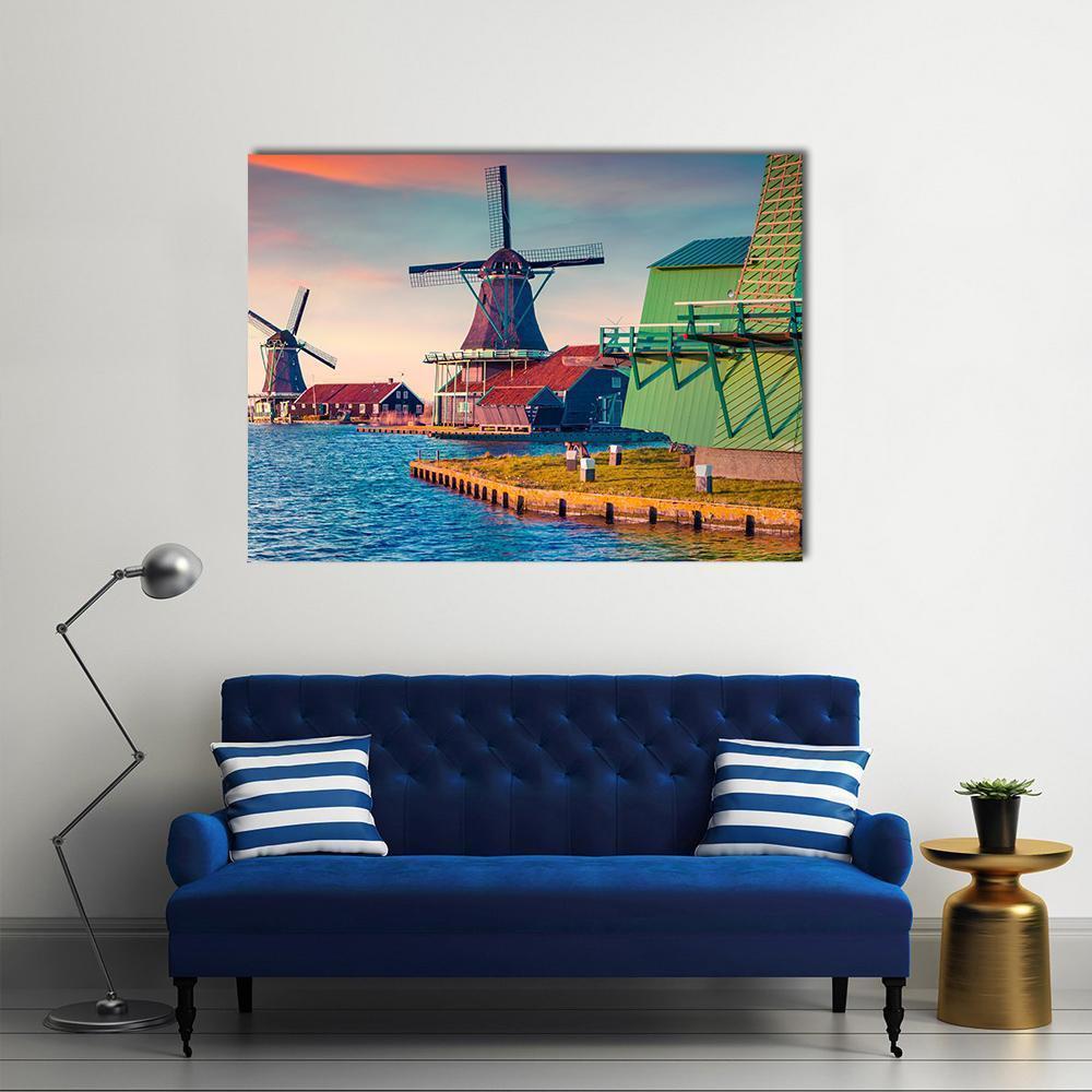 Zaandam Windmills on Water Channel Canvas Wall Art in orange, green and blue, single panel hung on a wall