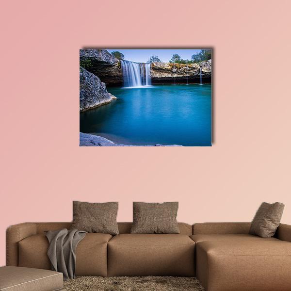 Zarecki Krov Waterfall Canvas Wall Art in gray, brown and blue, single panel hung on a wall
