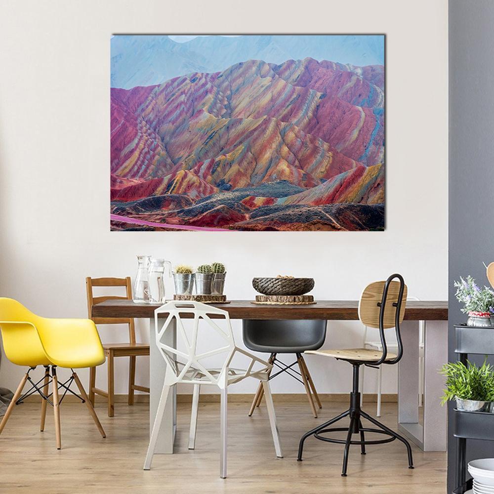 Vibrant Rainbow Mountains of Zhangye Canvas Wall Art in blue, pink and multicolor, single panel hung on a wall