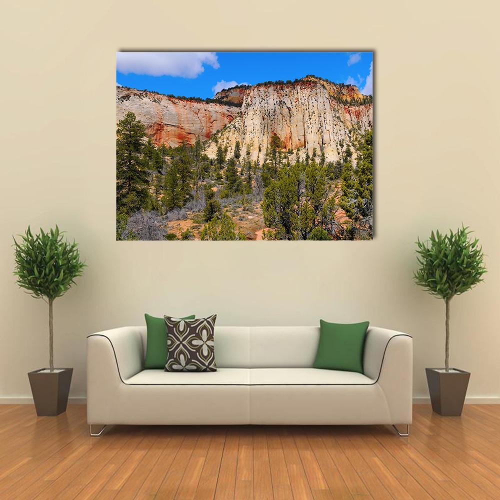 Zion National Park Layered Rock Formations Canvas Wall Art in orange, green and blue, single panel hung on a wall